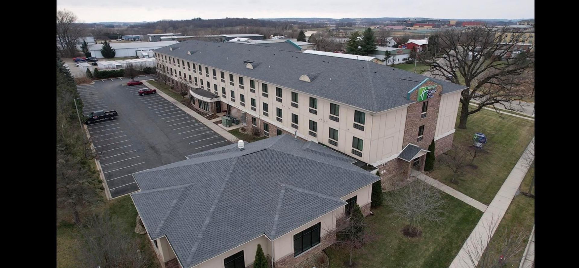 A group of construction workers are working on a roof.