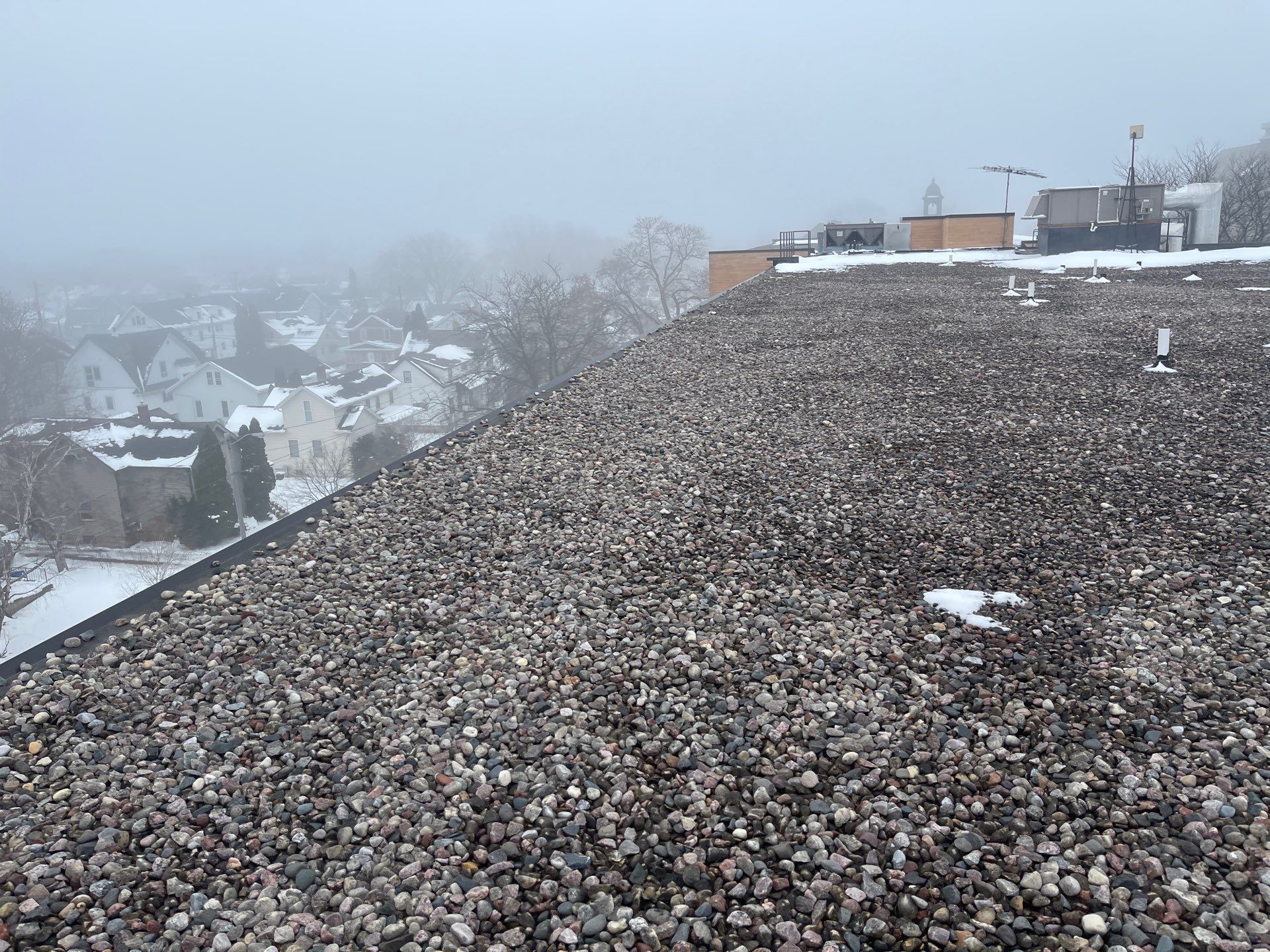 A man is plastering a wall with a spatula.