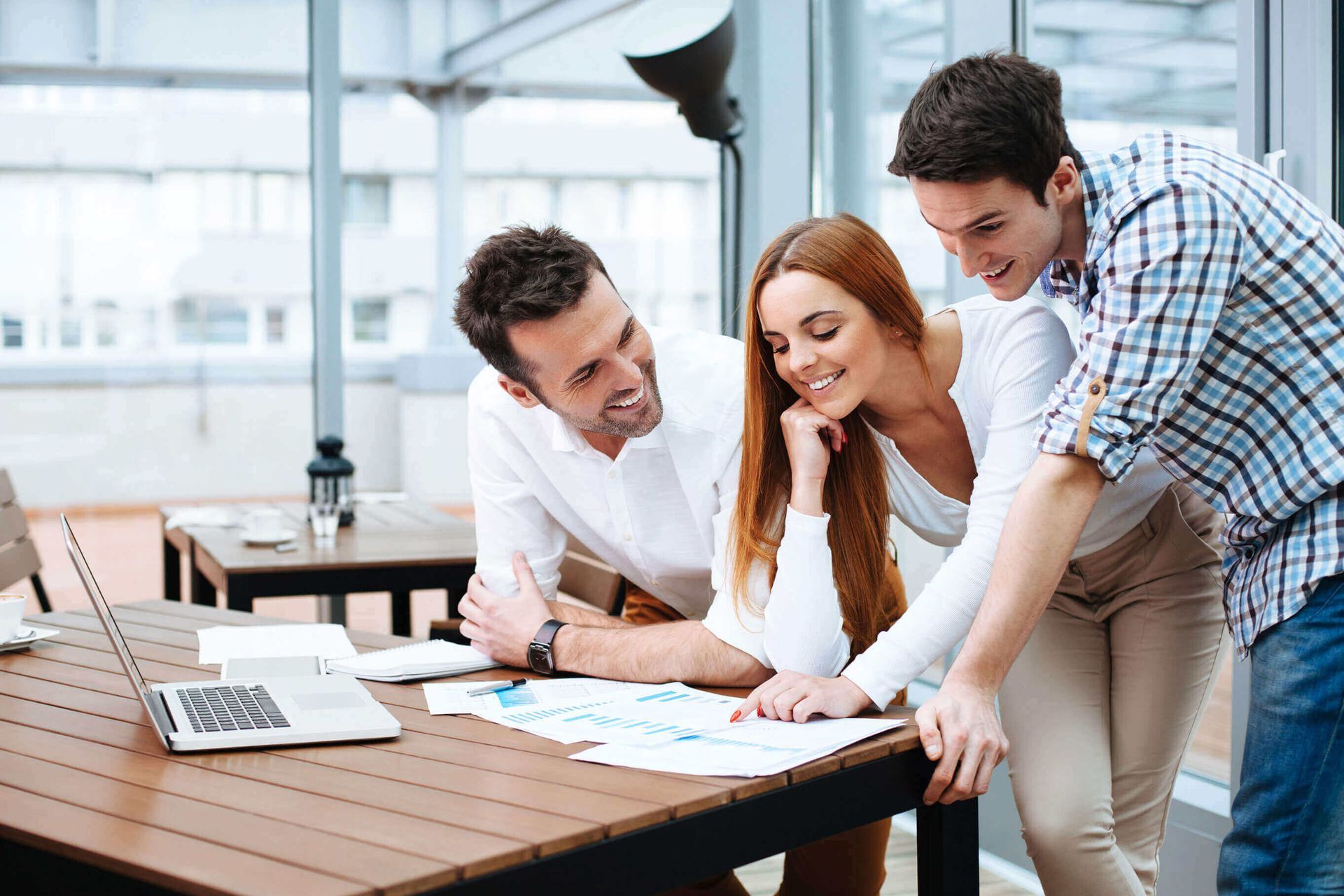 A group of people are having a meeting in an office.