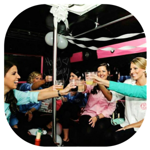 Friends toasting drinks in a festive black, pink, and white party room