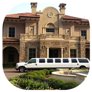 White stretch limousine parked in front of a large Mediterranean-style mansion with a fountain.