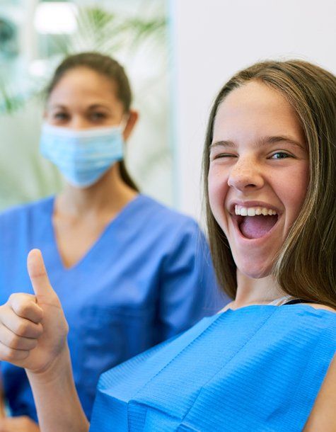 Dental Patient Showing Thumbs Up — Jacksonville, IL — College Avenue Dental Randall E. Lawson D.D.S.