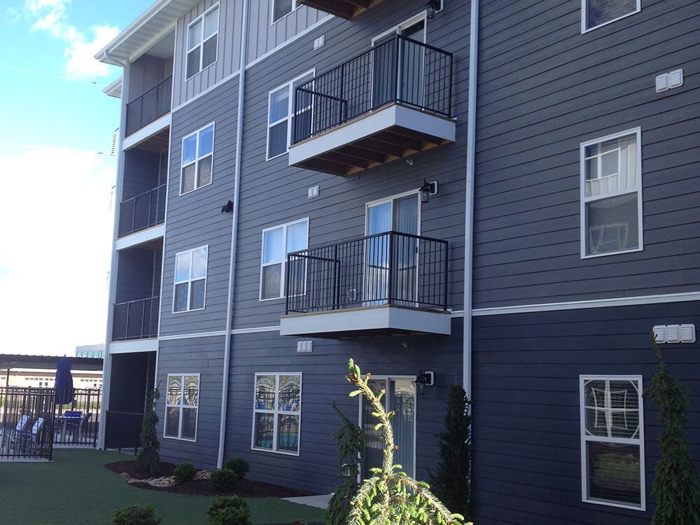 A large apartment building with lots of windows and balconies