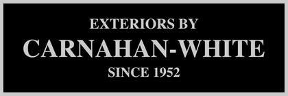 A black sign that says exteriors by carnahan-white since 1952