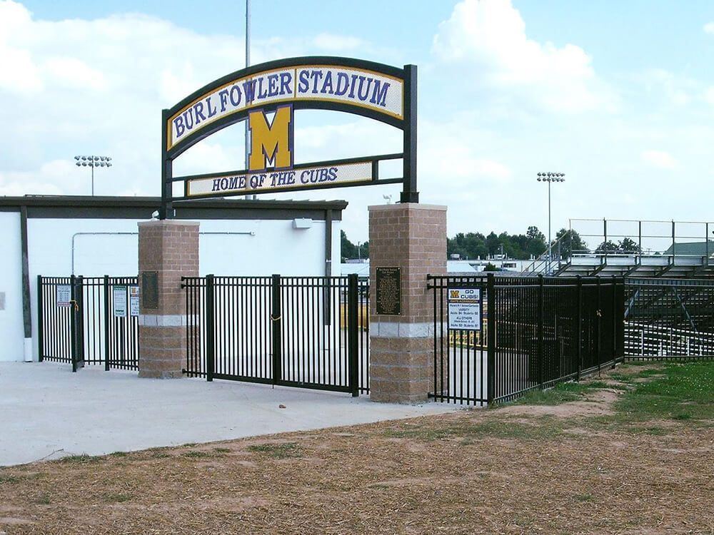 The entrance to the bull fowler stadium is behind a fence