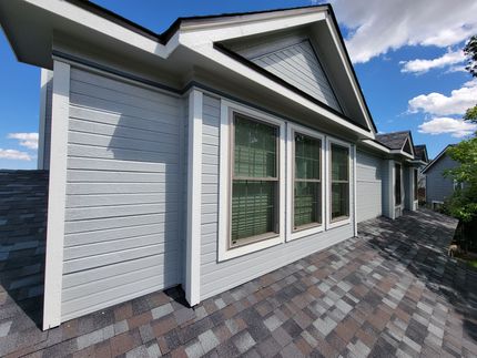 A house in Colorado Springs after trim and siding repair and a professional paint job