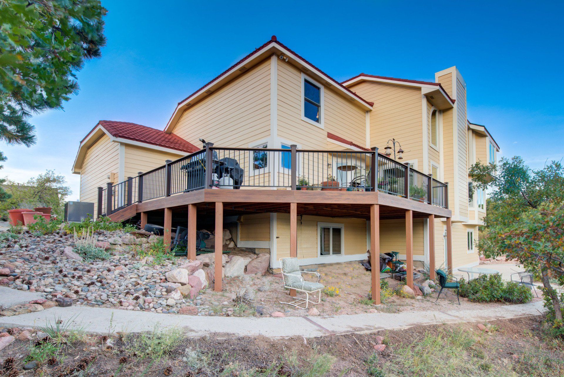 a large house with a large deck on top of it .