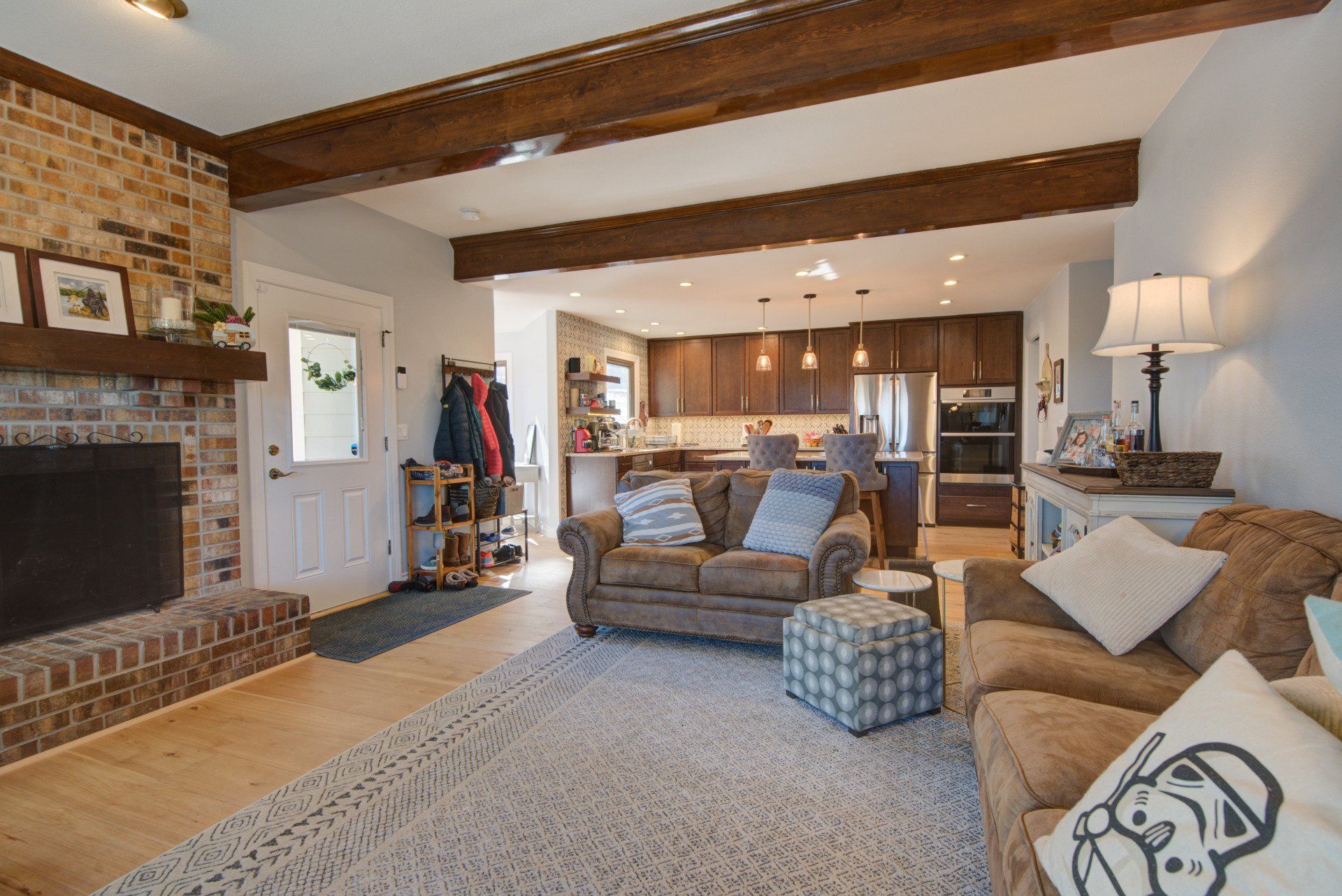 A living room filled with furniture and a fireplace.