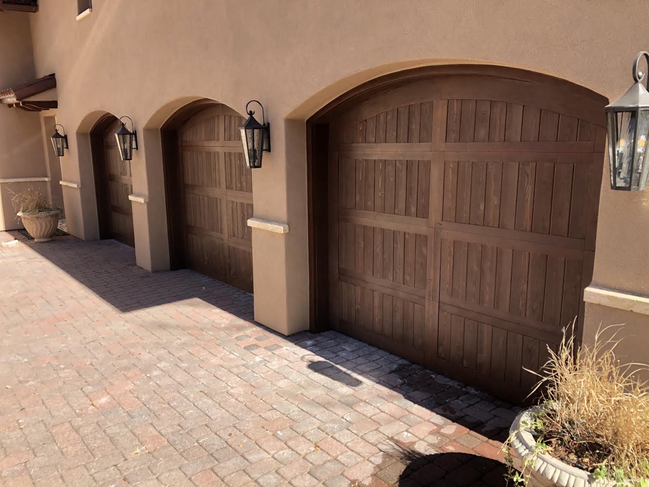 A row of garage doors on the side of a building