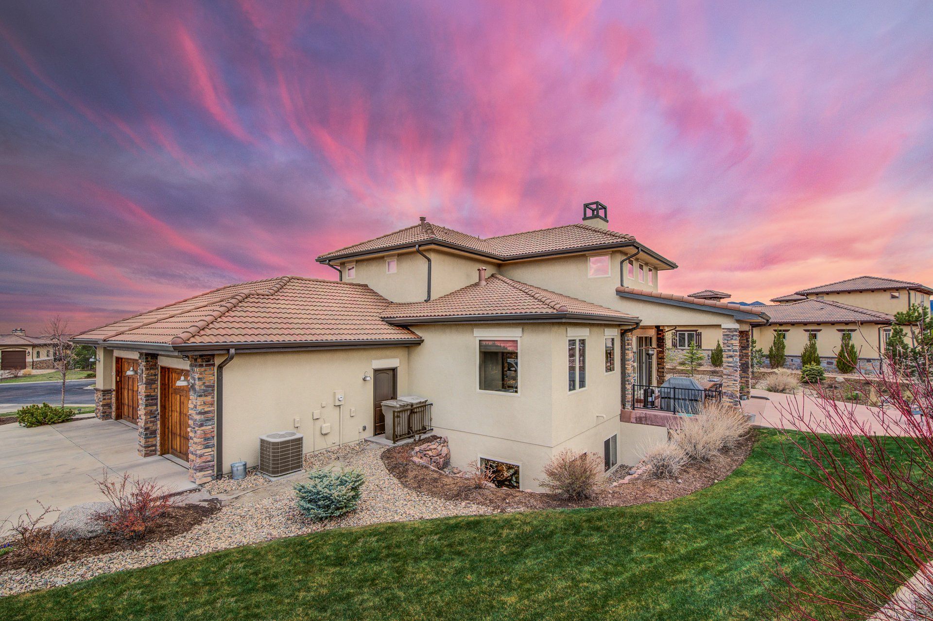 A large house with a purple sky in the background.