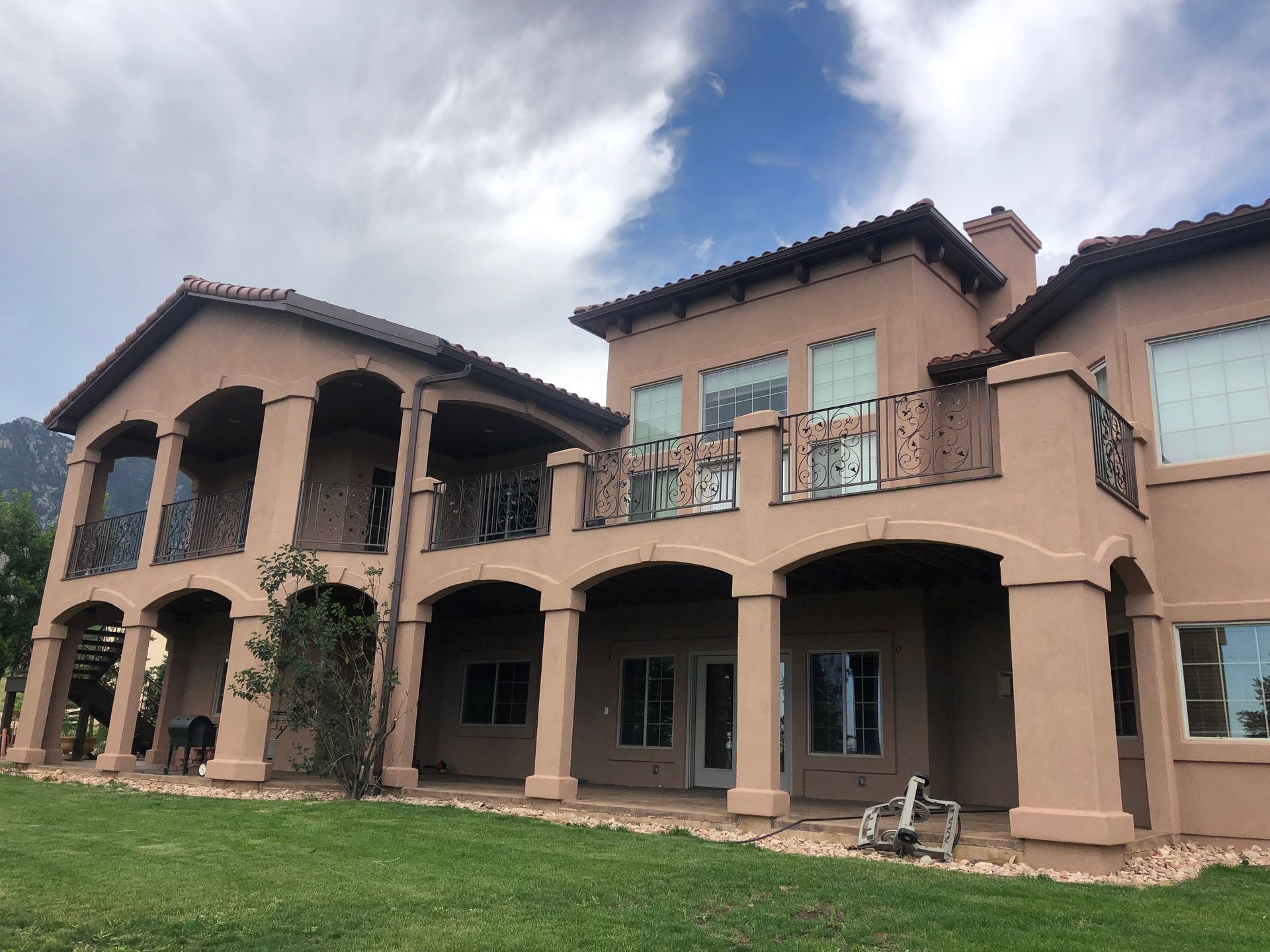A large house with a lot of windows and balconies