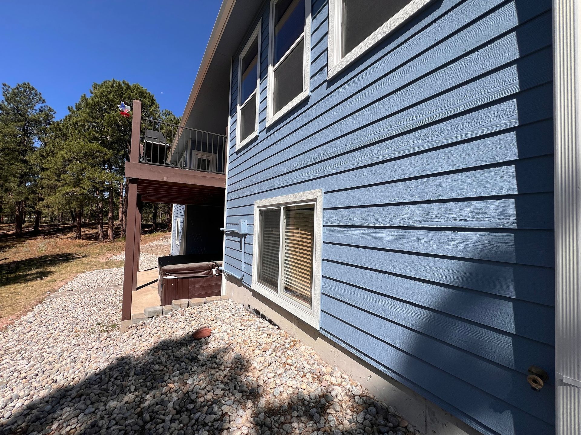A freshly painted house in Colorado Springs with blue paint to protect from the Colorado UV Rays