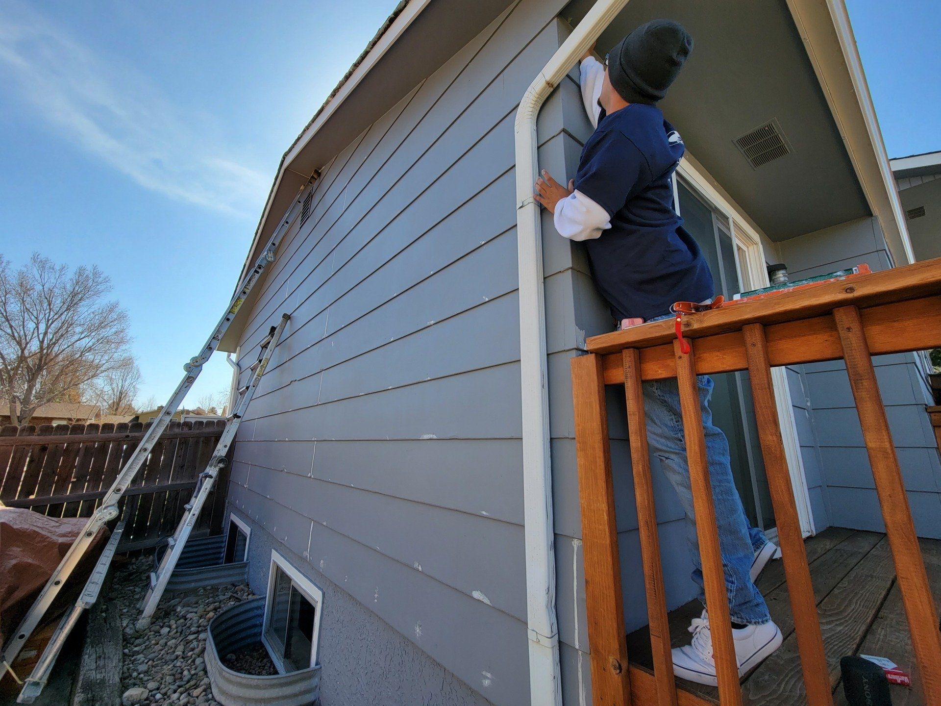 Caulking house exterior in Colorado Springs