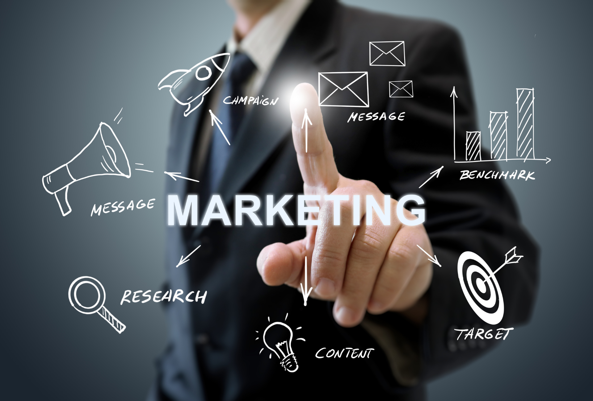 Man in suit pointing at 