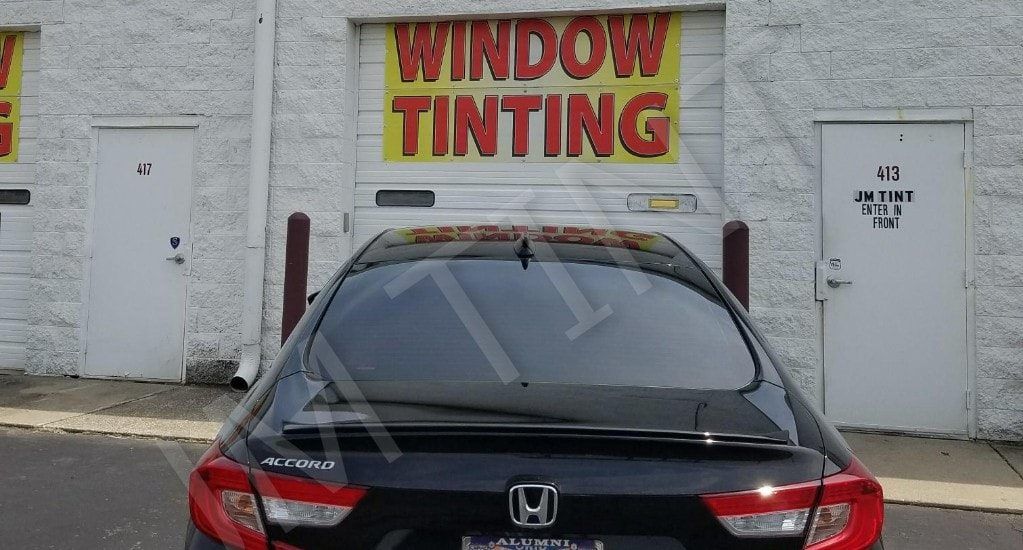 Premium Tint Installation — Back Window Of A Black Vehicle in Columbus, OH