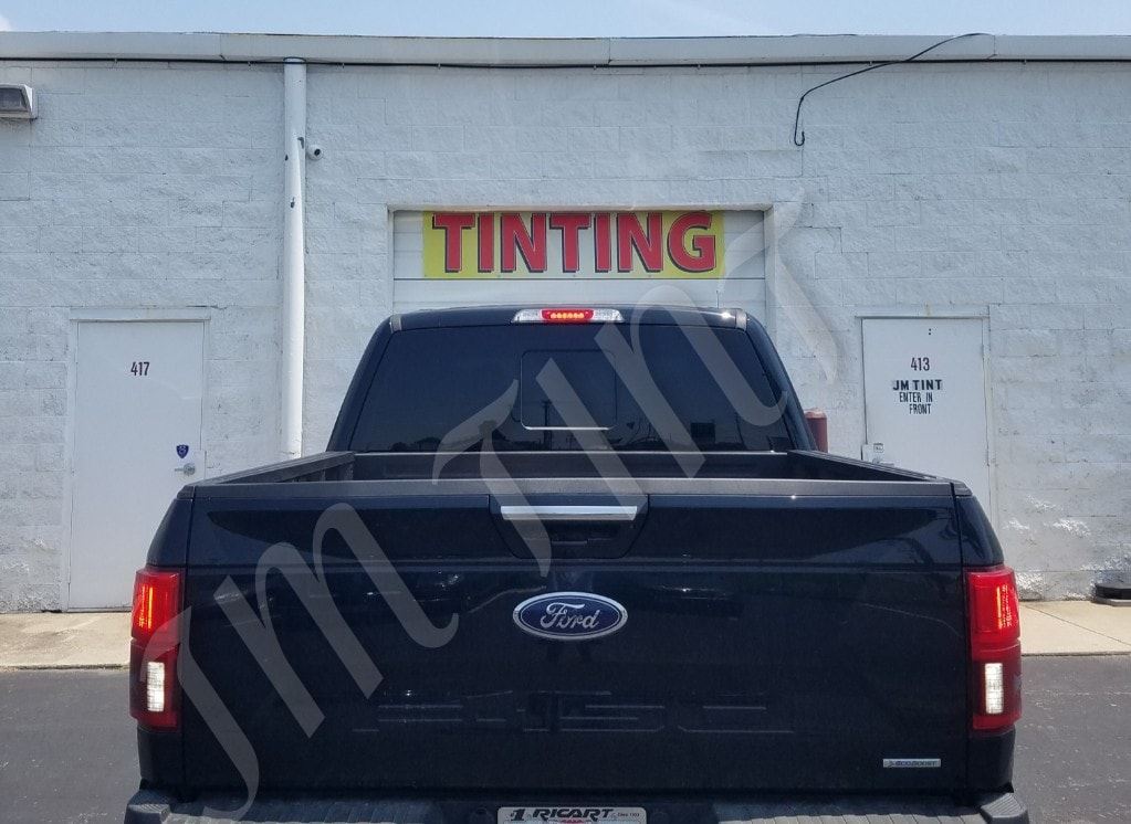 New Window Tint Installation Services  — Back Window Of Black Car After Tinting in Columbus, OH