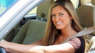 Woman driving car fixed by Ridge Transmission, Inc.
