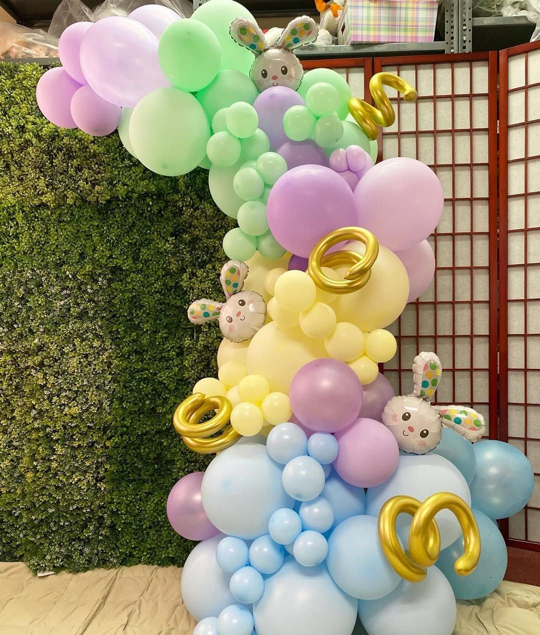 A bunch of balloons are stacked on top of each other