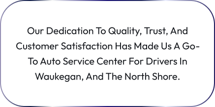 A tire and auto service building with cars parked in front of it | Sunset Tire and Auto Repair