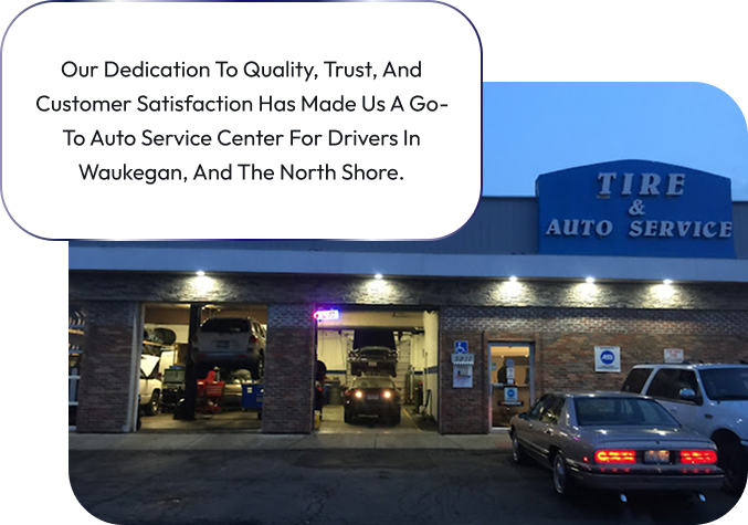A tire and auto service building with cars parked in front of it | Sunset Tire and Auto Repair