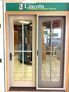 a sliding glass door is displayed in a store .