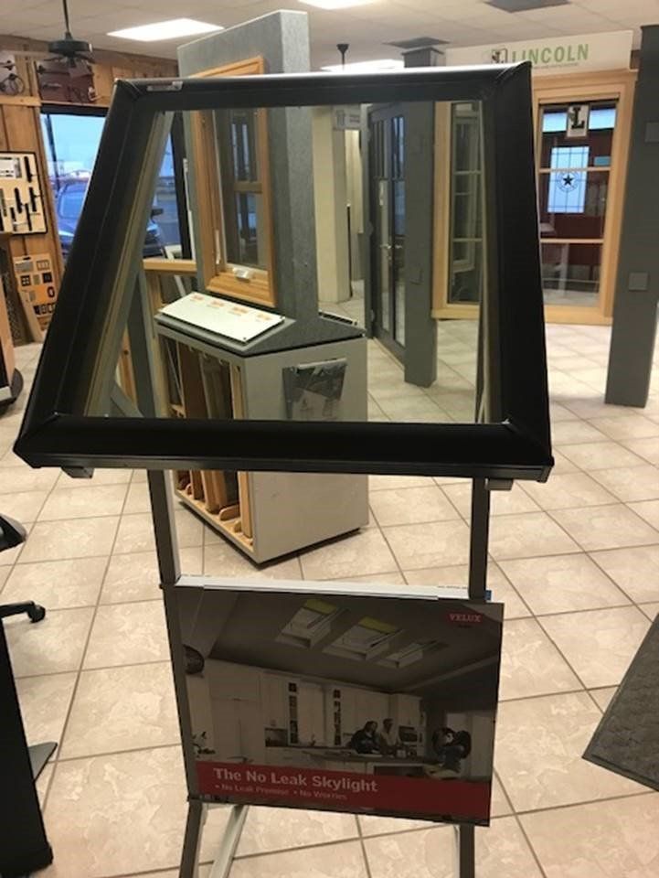 a mirror is displayed on a stand in a store