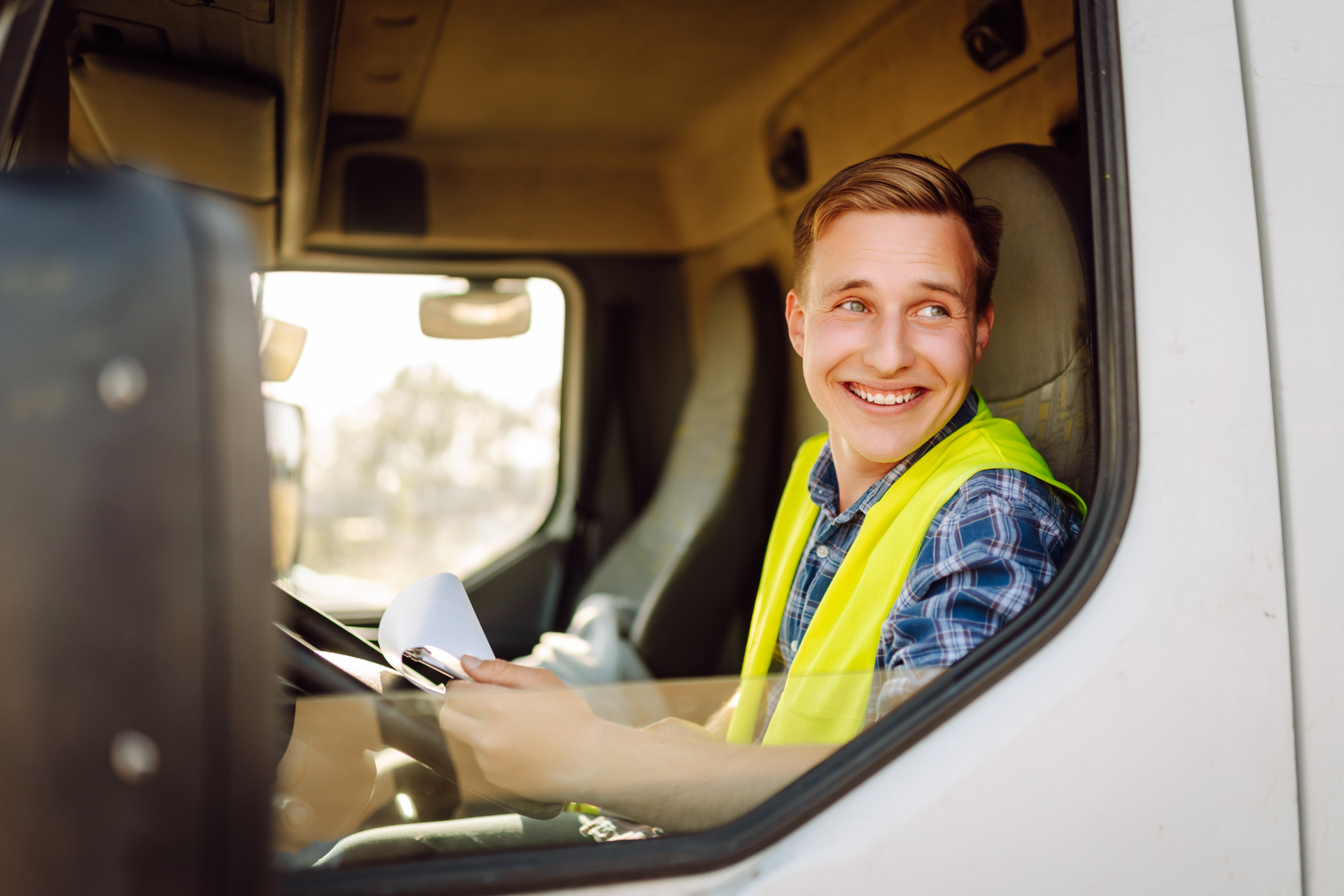 Tall white buildings and palm trees against a bright blue sky in Miami.