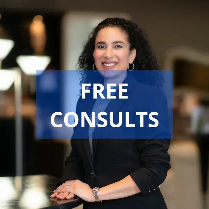 Woman in a suit with curly hair smiles, text says 