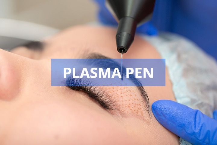Plasma pen procedure on a woman's closed eye, performed by a gloved hand. Device is black; woman has blue surgical cap.