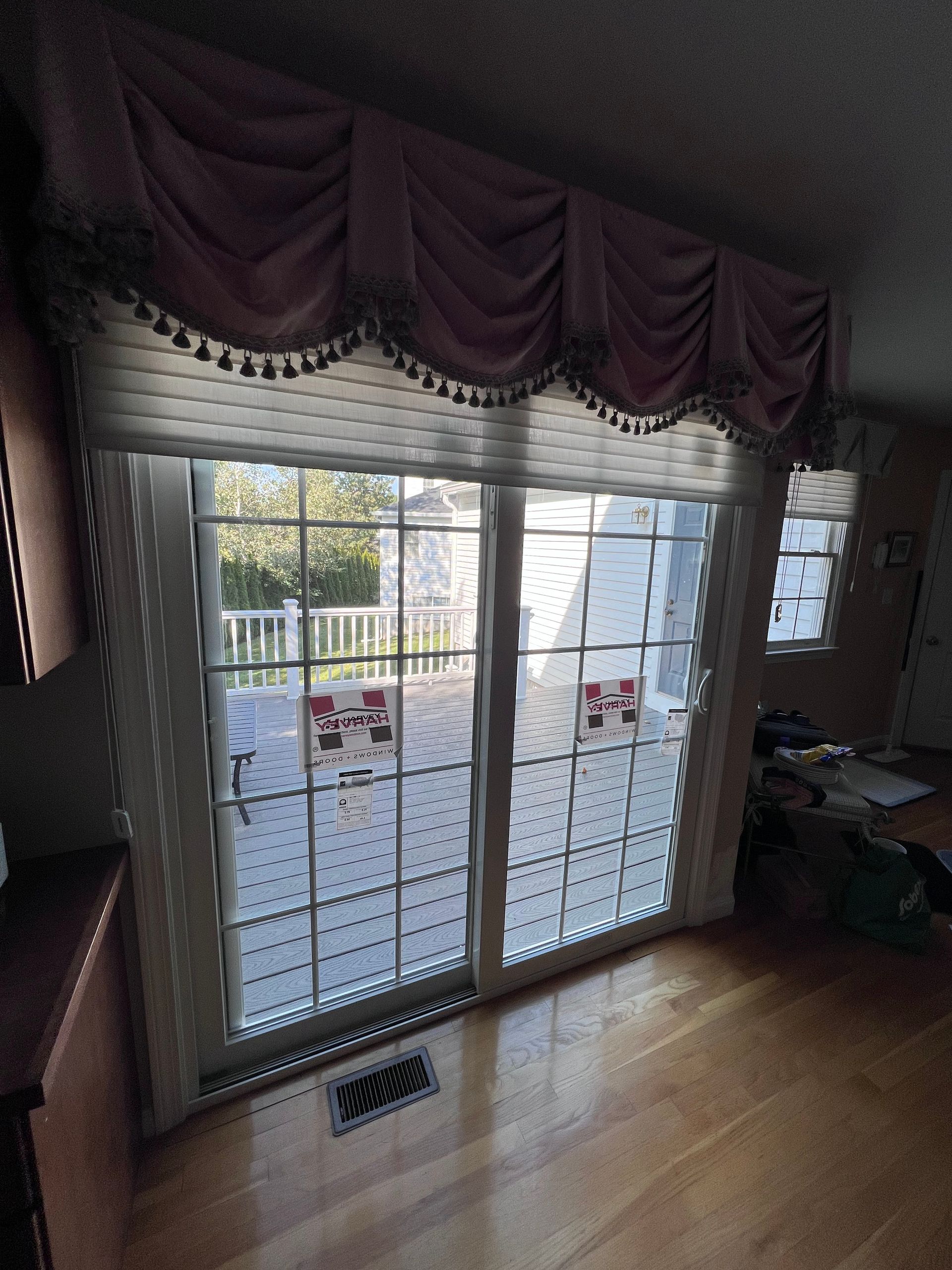 A living room with a sliding glass door leading to a patio.