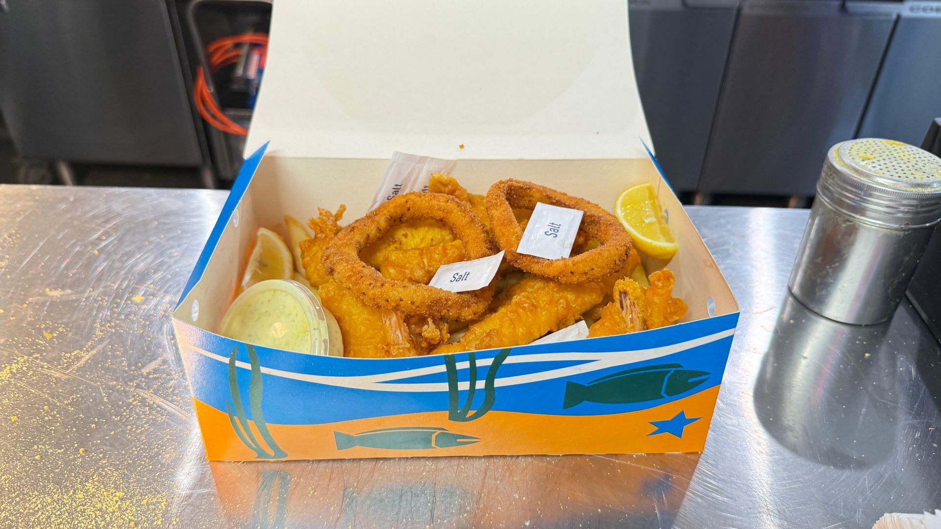 Fries, Fish, Shrimp, Onion Rings, and Crab Cakes in Cardboard Trays — Aussie Fish & Chips Nelson Bay in Nelson Bay, NSW
