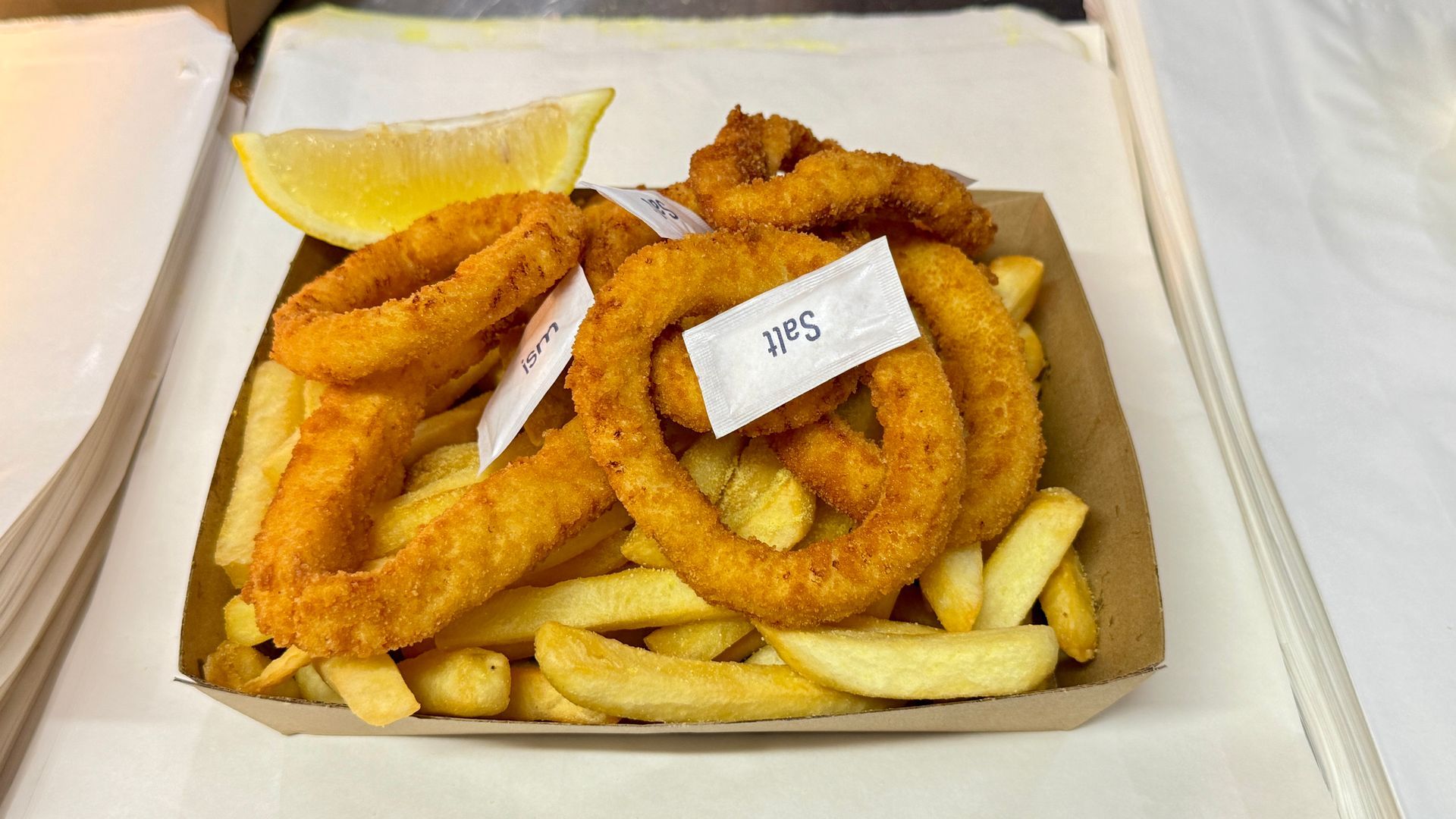 Fried Shrimp on a Metal Rack on a Stainless Steel Surface — Aussie Fish & Chips Nelson Bay in Nelson Bay, NSW