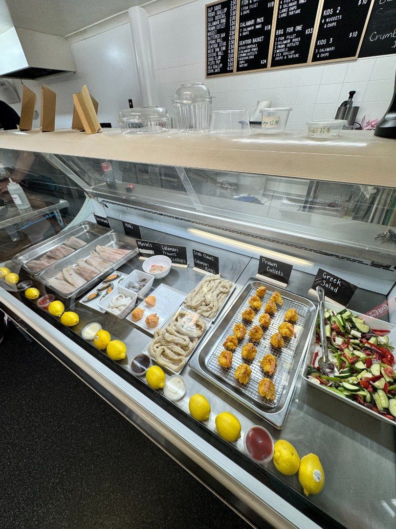 A Seafood Display Case With Various Foods — Aussie Fish & Chips Nelson Bay in Nelson Bay, NSW