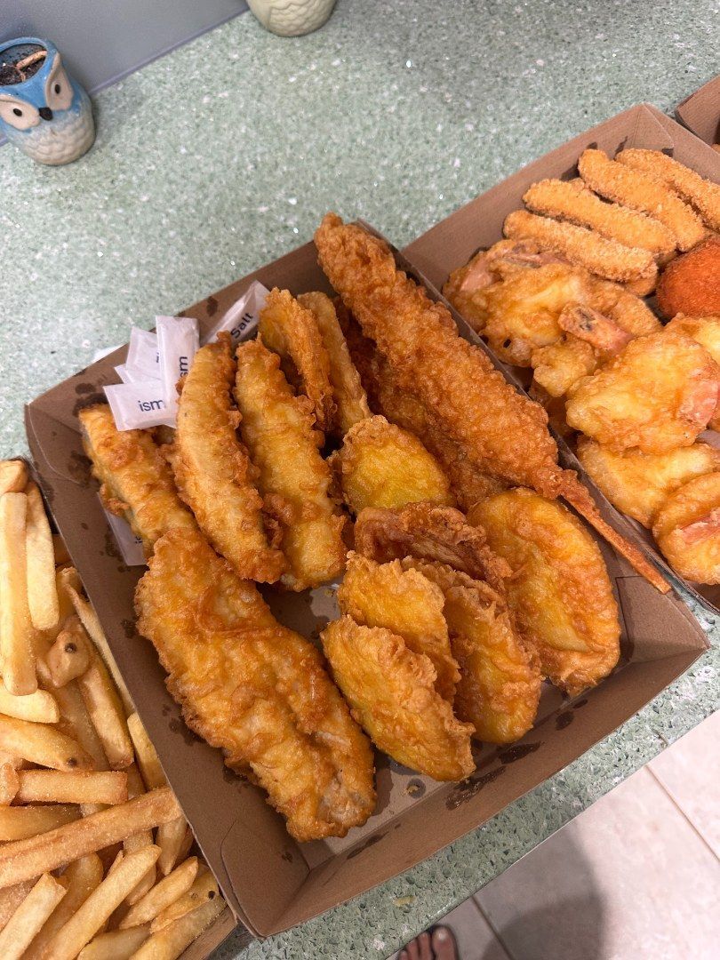 A Tray of Deep-fried Foods, Including Fish, Fries, and Fried Shrimp — Aussie Fish & Chips Nelson Bay in Nelson Bay, NSW
