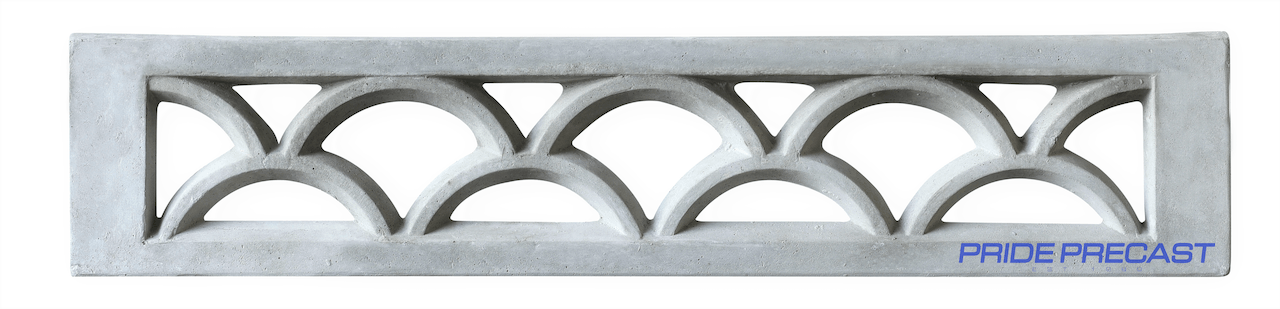 A concrete wall with a pattern of triangles on it