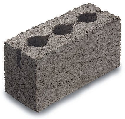 A concrete block with two holes in it
