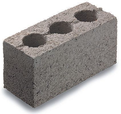 A concrete block with three holes in it