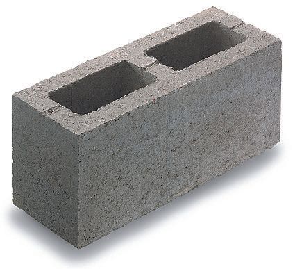 A gray concrete block with two holes in it
