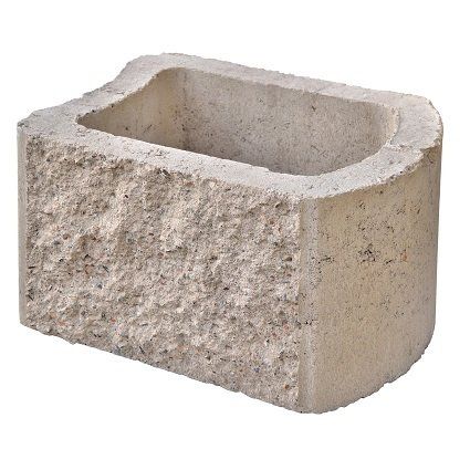 A concrete block with a hole in the middle on a white background