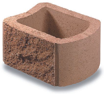 A brown concrete block with a hole in the middle