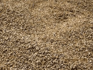 A close up of a pile of brown gravel.
