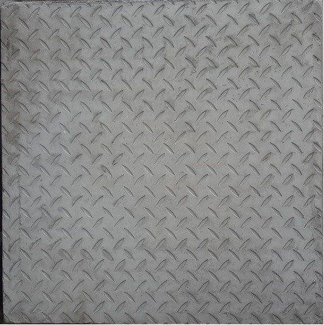 A close up of a metal plate with a diamond pattern on it.