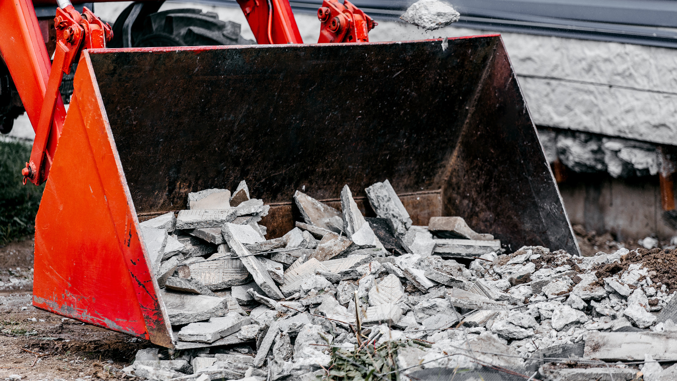 A pile of wood and plastic is stacked on top of each other. - debris removal
