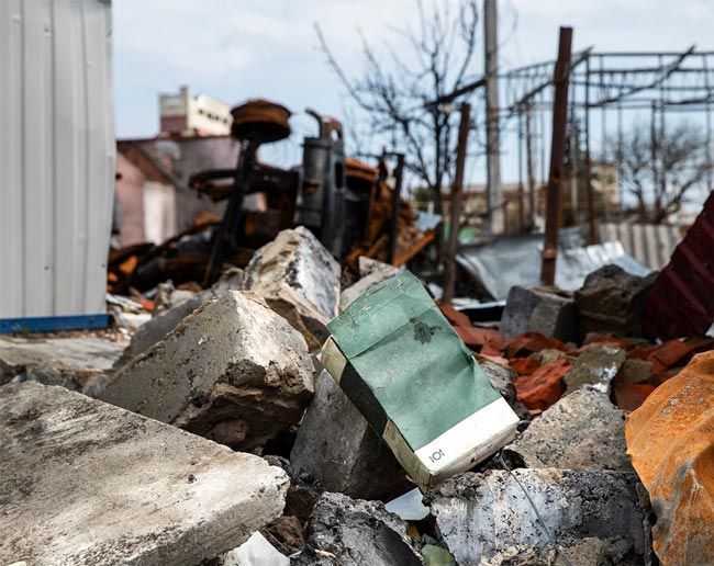 A pile of rocks with a green box in the middle - demolition contractor long island