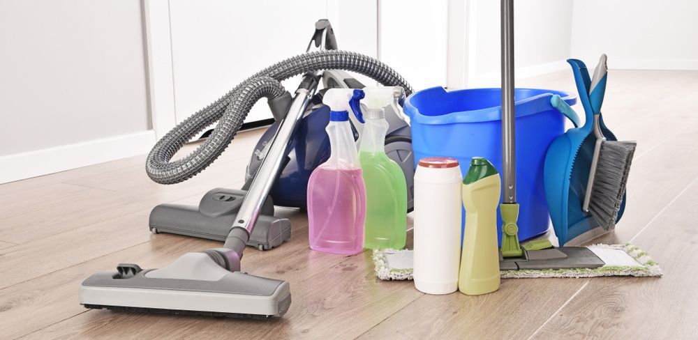 A Vacuum Cleaner, Mop, Bucket, and Cleaning Supplies Are on The Floor — North Coast Commercial Cleaners In Caloundra, QLD