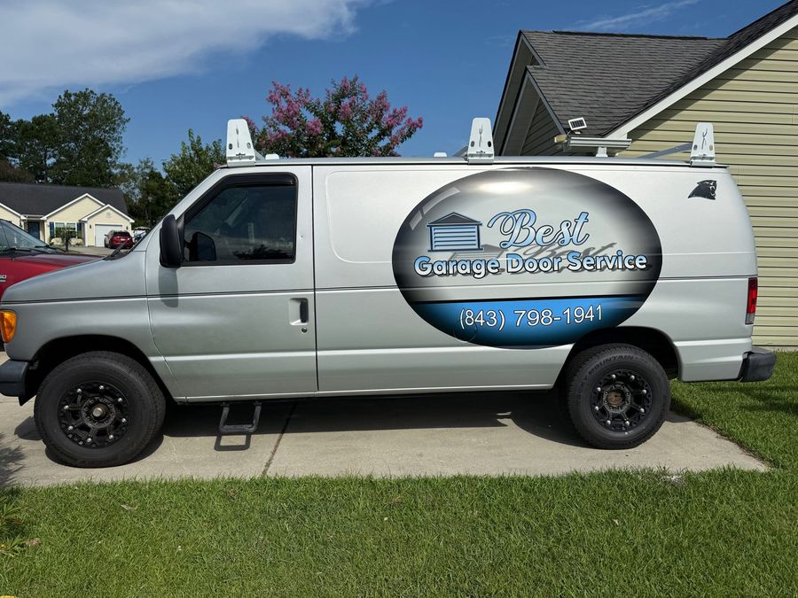 A silver van with the word garage on it