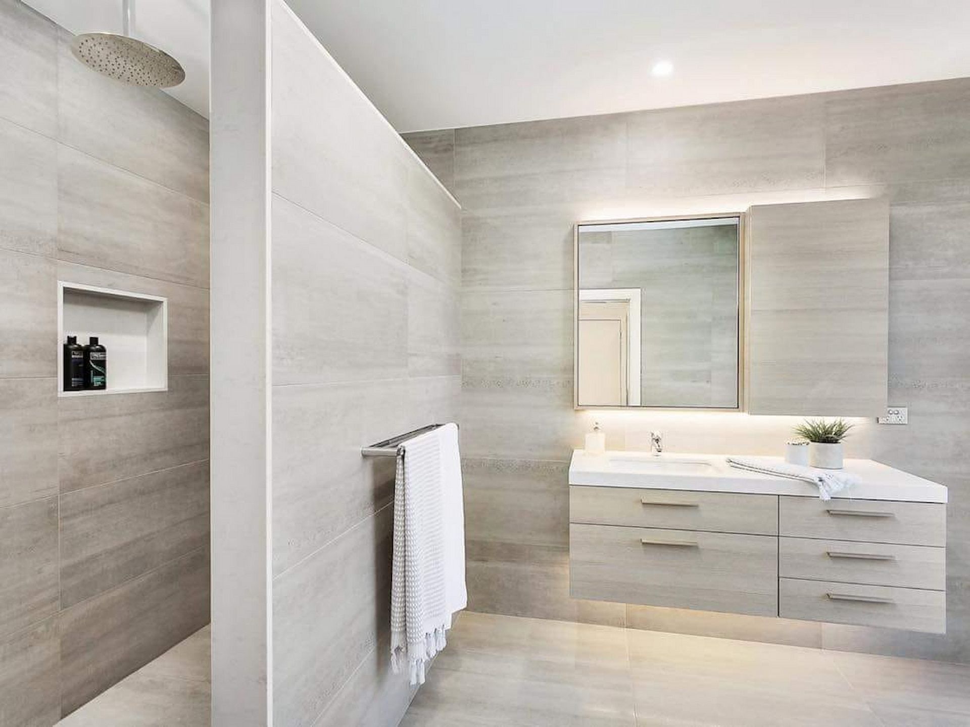 A Bathroom With Beige Tiles — Corrimal Ceramic Tiles Pty Ltd in Bowral, NSW