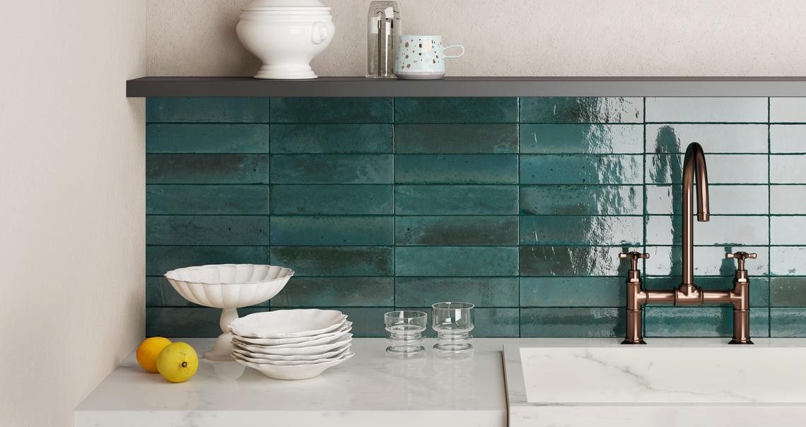 A Kitchen With Blue Tiles And A Sink — Corrimal Ceramic Tiles Pty Ltd in Corrimal, NSW