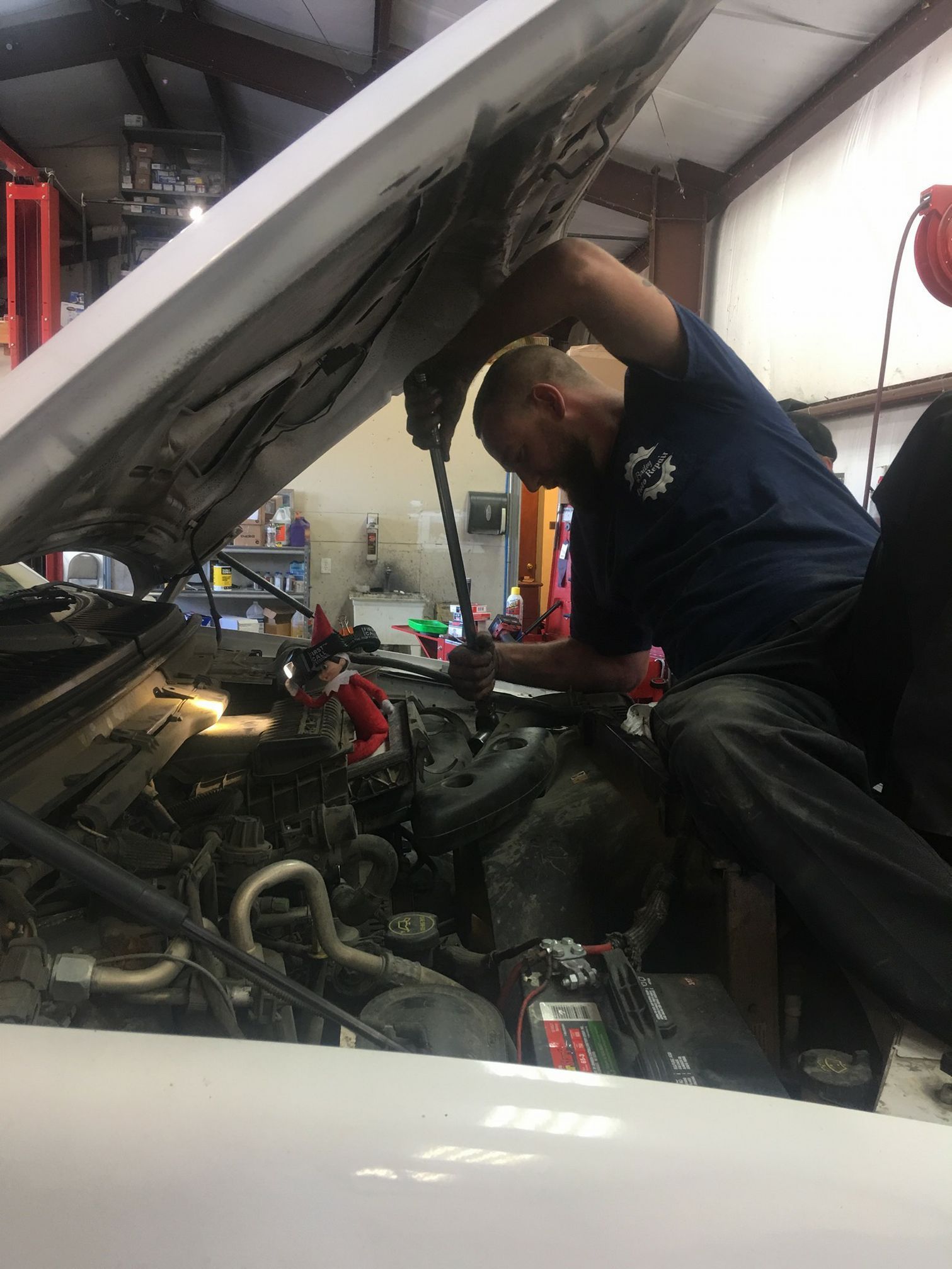 Mechanic working on a car engine | Bailey Automotive