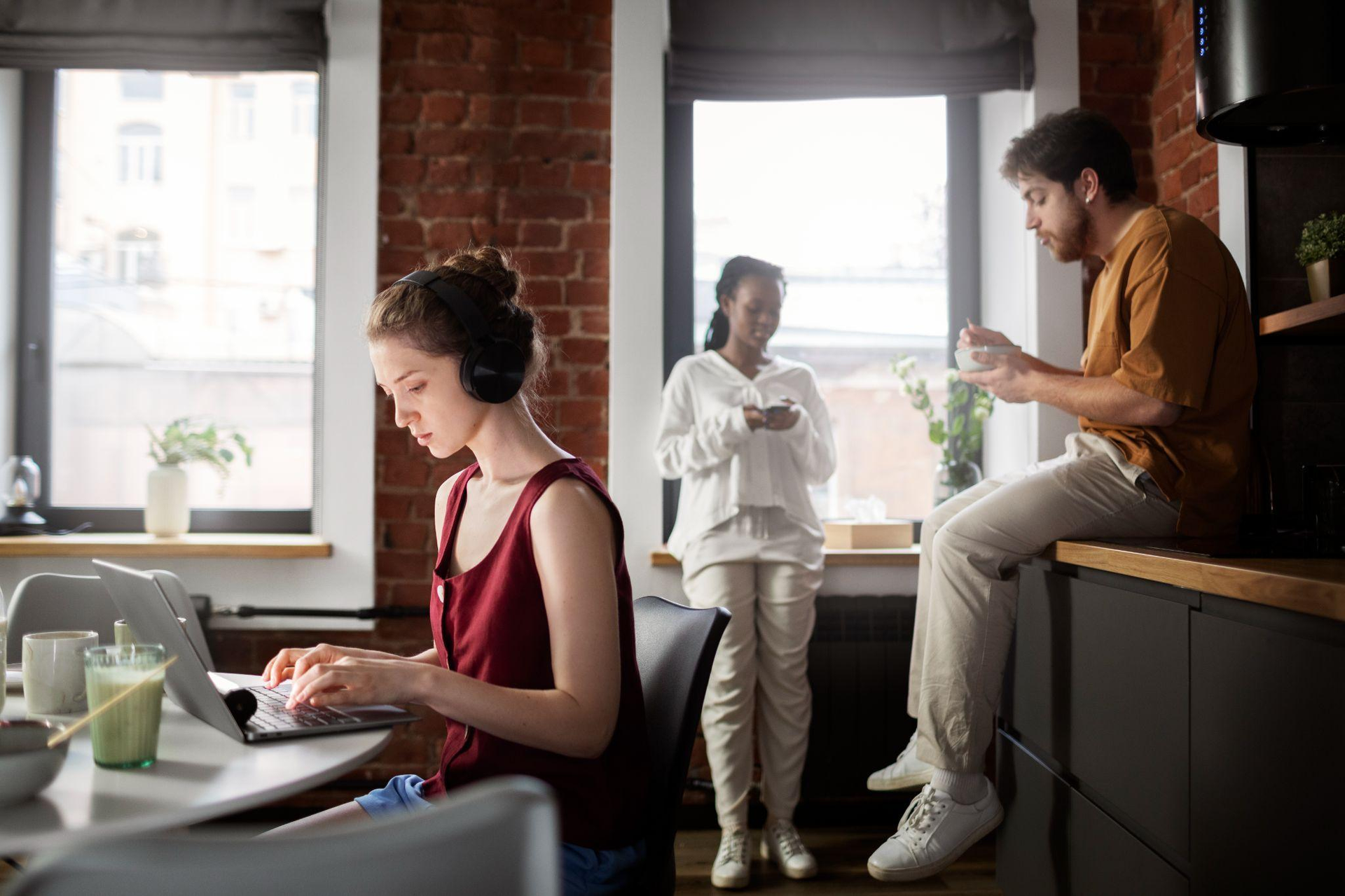 A group of tenants interacting in a modern co-living space.